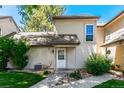 Charming home exterior with a beige facade, landscaped yard, and inviting front entrance at 2101 S Victor St # C, Aurora, CO 80014