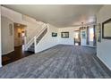 Spacious living room with carpeted floors and lots of natural light at 245 Dunhill St, Castle Rock, CO 80104