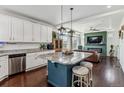 Open-concept kitchen featuring a large island, stainless appliances and seamlessly flows to the living area at 10560 Waco St, Commerce City, CO 80022