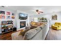 Cozy living room with a fireplace, flat screen tv, modern furniture and bright, neutral colors at 7868 Downing St, Denver, CO 80229