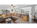Comfortable living room with a ceiling fan, stylish decor and a large sectional sofa at 7868 Downing St, Denver, CO 80229
