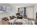 Cozy living room filled with natural light showcasing comfortable seating and stylish decor at 1011 Uvalda St, Aurora, CO 80011