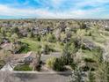 Expansive aerial view showcasing the neighborhood, lush greenery, and a serene environment at 683 Sunnyside St, Louisville, CO 80027
