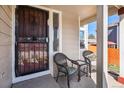 Inviting front porch featuring seating, offering a relaxing outdoor space at 16277 Blueleaf Pl, Parker, CO 80134