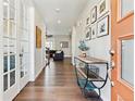 Inviting entryway featuring hardwood floors, natural light, and decor at 8102 S Adams Fork Ave, Littleton, CO 80125