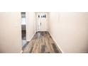 Inviting entryway featuring durable flooring, leading into the main living space at 12652 Glencoe St, Thornton, CO 80241