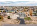 House in a residential neighborhood with a large yard at 16351 Umpire St, Hudson, CO 80642