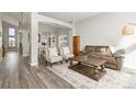 Spacious living room with hardwood floors and large windows at 16351 Umpire St, Hudson, CO 80642