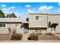 Close up view of townhomes featuring well-maintained lawns and sidewalks leading to the front doors at 5711 W 92Nd Ave # 30, Westminster, CO 80031