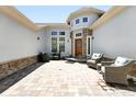 Inviting front porch with stylish seating, stone accents, and a well-maintained facade creating a welcoming entrance at 4944 W 107Th Loop, Westminster, CO 80031