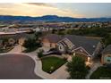 An aerial view showcasing the home's location, landscaping, and mountain views at 444 Pasada Way, Monument, CO 80132