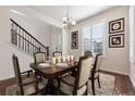 Charming dining room with a wooden table, seating for six, elegant decor and great natural light at 11896 Meade Ct, Westminster, CO 80031