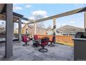 Outdoor patio with seating area, a built-in grill, and pergola at 4942 S Zephyr St, Littleton, CO 80123