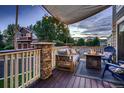 Relaxing deck with fire pit, outdoor seating, and overhead shade canopy for entertaining at 19551 E Mann Creek Dr # B, Parker, CO 80134