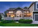 Wonderful back deck perfect for relaxation with exterior lighting and shade elements at 19551 E Mann Creek Dr # B, Parker, CO 80134