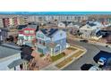 Beautiful aerial view of modern homes, community, and mountain backdrop at 5295 Andes St, Denver, CO 80249