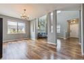 Bright, open-concept living room with hardwood floors and large windows at 3475 Golden Spur Loop, Castle Rock, CO 80108