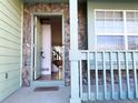 Open front door revealing the interior entryway and staircase at 3802 Desert Willow Ave, Broomfield, CO 80020