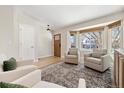 Light-filled living room with bay window and comfortable seating at 5603 W 118Th Pl, Broomfield, CO 80020