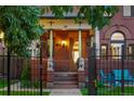 Inviting front porch with lion statues and an elegant entrance to the home at 2155 N High St, Denver, CO 80205