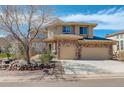 Charming home featuring a stone and stucco facade, a well-manicured lawn, and a convenient three-car garage at 5830 Jasper Pointe Cir, Castle Pines, CO 80108