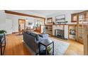Bright living room with a fireplace, hardwood floors, and an open layout at 618 Adams St, Denver, CO 80206