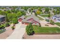 Beautiful aerial view of this home and well-manicured yard and garden; fenced backyard at 16283 Olive Way, Brighton, CO 80602