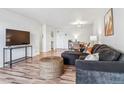 Bright and airy living room with wood floors and stylish furniture, perfect for relaxing and entertaining at 888 N Logan St # 5A, Denver, CO 80203