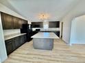 Spacious kitchen featuring a large island and stainless steel appliances at 8362 Jasmine St, Commerce City, CO 80022