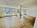 Bright and airy living room with lots of natural light and wood flooring at 8362 Jasmine St, Commerce City, CO 80022
