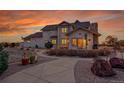 Spacious backyard with a stone patio, built-in grill, and manicured landscaping, perfect for outdoor entertaining at 1012 S Addison Way, Aurora, CO 80018