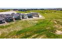 View of new home construction showcasing backyard views and neighborhood at 3327 Backdrop Ct, Castle Rock, CO 80108