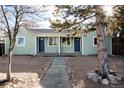 Duplex home with light green exterior and walkway at 1448 W Nevada Pl, Denver, CO 80223