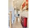 Inviting hallway with hardwood floors and decorative accents at 11235 S Neu Towne Cir, Parker, CO 80134