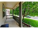 Inviting covered front porch with nice views of the yard and neighborhood at 7245 Prairie Cir, Longmont, CO 80504