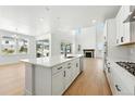 Open-concept kitchen with a central island, modern appliances, and an airy, well-lit atmosphere at 1733 Fox Trotter Pt, Castle Rock, CO 80104