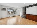 Bright living room with hardwood floors and large window at 1442 S Logan St, Denver, CO 80210