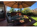 Deck with patio furniture, umbrella, and privacy fence at 2834 S Fig St, Lakewood, CO 80228