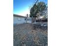 Large backyard with a partially damaged tree at 14697 E Oregon Dr, Aurora, CO 80012