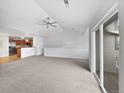 Spacious living room with vaulted ceilings, plenty of natural light, and an open-concept layout at 10818 Cimarron St # 307, Firestone, CO 80504