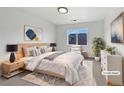 Comfortable main bedroom featuring a cozy rug, a soothing color palette, and ample natural light at 10818 Cimarron St # 307, Firestone, CO 80504
