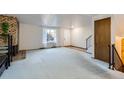 Spacious living room with fireplace and carpet at 1770 Robb St, Lakewood, CO 80215