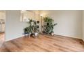 Living room featuring hardwood floors and abundant plants at 614 Glenwood Dr, Lafayette, CO 80026