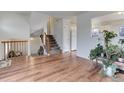 Spacious living room with hardwood floors and staircase at 614 Glenwood Dr, Lafayette, CO 80026