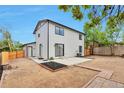 Spacious backyard with a large patio area, perfect for outdoor entertaining and relaxation at 3575 S Ouray St, Aurora, CO 80013