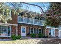 Charming brick two-story townhome with a delightful upstairs balcony and beautiful landscaping at 2437 E Geddes Pl, Centennial, CO 80122