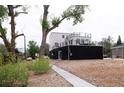 Modern two-story home showcasing sleek design and an inviting outdoor deck, perfect for entertaining at 5462 S Cedar St, Littleton, CO 80120