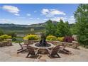 Outdoor fire pit and seating area, perfect for entertaining with a beautiful mountain view at 15490 W Asbury Ave, Lakewood, CO 80228