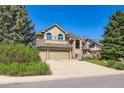 Charming two-story home with a three-car garage and mature trees in a serene neighborhood at 9096 E Colorado Cir, Denver, CO 80231