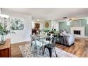 Bright dining area with glass table and modern chairs at 1800 S Tennyson St, Denver, CO 80219